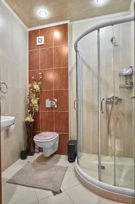 a bathroom with a shower and a toilet at The Love Nest - 1BD Apartment in Sunny Beach by Flat Mаnаger in Sunny Beach