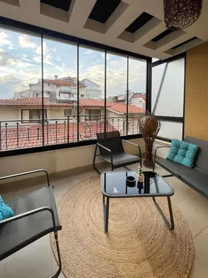 a living room with a couch and a coffee table at SOS CoMFORT 2 LAZUR in Burgas City