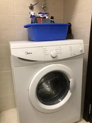 a washing machine with a bowl on top of it at Private Studio Sunny Beach- Cascadas in Sunny Beach