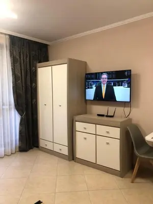 a living room with a flat screen tv on a wall at Private Studio Sunny Beach- Cascadas in Sunny Beach