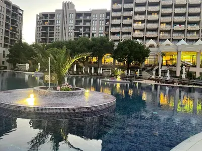 a large swimming pool in a city with tall buildings at Royal Beach NICE VIEW in Sunny Beach