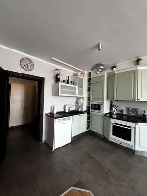 a kitchen with green cabinets and white appliances at Apartment for rent in Sunny Beach/ Nessebar in Nesebar