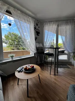 a living room with a table with a bowl of fruit on it at Apartment for rent in Sunny Beach/ Nessebar in Nesebar