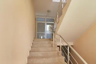 a staircase in a house with a glass door at Apartment for rent in Sunny Beach/ Nessebar in Nesebar