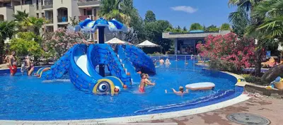 a group of children playing in a pool at a water park at Deluxe Appartements in Cascadas Family Resort Sunny Beach in Sunny Beach