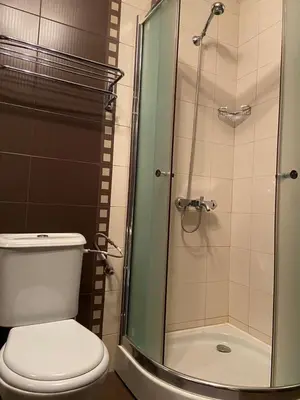 a bathroom with a toilet and a glass shower at SEAVIEW Heaven Sunny Beach in Sunny Beach