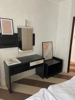 a bedroom with a desk and a mirror at SEAVIEW Heaven Sunny Beach in Sunny Beach