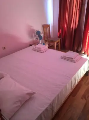 a bedroom with a large bed with a fan on it at 3 Bedroom Apt with Pool Views at Arcadia Complex in Sunny Beach