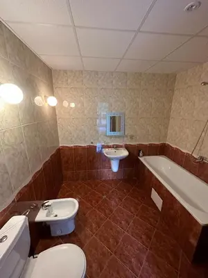 a bathroom with a toilet and a sink and a tub at Central, 3 Bedroom Apartment at Golden Fort Complex in Sunny Beach