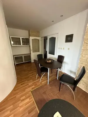 a dining room with a table and chairs in a room at Central, 3 Bedroom Apartment at Golden Fort Complex in Sunny Beach