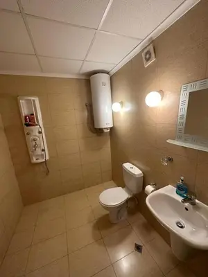 a bathroom with a toilet and a sink at Central, 3 Bedroom Apartment at Golden Fort Complex in Sunny Beach