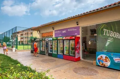 a group of people standing outside of a store at Ground Floor, Studio Apartment at Sunny Day 6 in Tŭnkovo