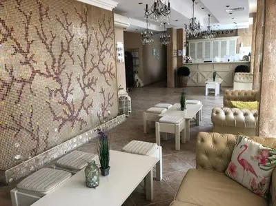a waiting room with couches and tables in a store at Spacious, 1 Bed Apt, Dawn Park in Sunny Beach