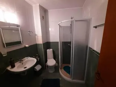 a bathroom with a shower and a toilet and a sink at Central, 1 Bed Apt, 3* Yassen in Sunny Beach