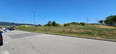 an empty road with a street light on the side of a field at Studio Nina in Primorsko