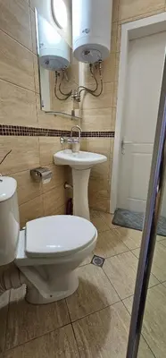 a bathroom with a toilet and a sink at Studio Nina in Primorsko