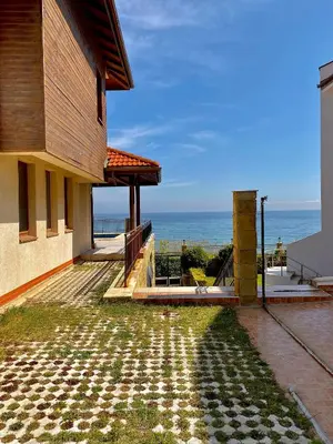 a house with a view of the ocean at SH Holidays & Health Beach-Apartments in Sozopol