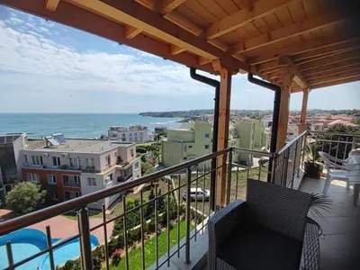 a balcony with a view of the ocean at The View Apartment in Sozopol