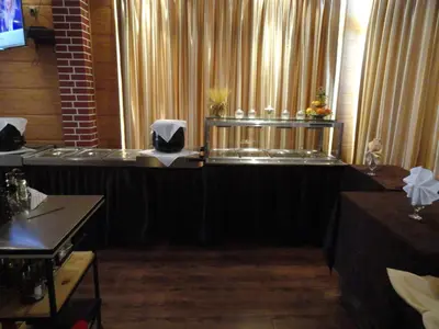 a room with a stage with a table and a window at Cantilena Complex in Sunny Beach