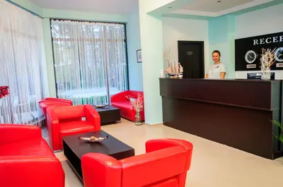 a woman standing at the cash register of a salon at Cantilena Complex in Sunny Beach