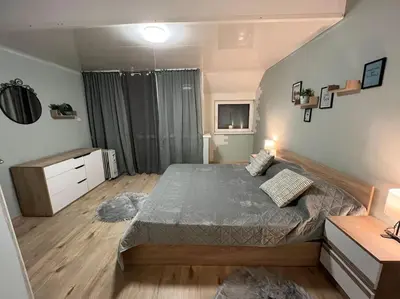 a bedroom with a large bed in a room at Център Варна апартамент с паркинг за нормална до средно голяма кола in Varna City