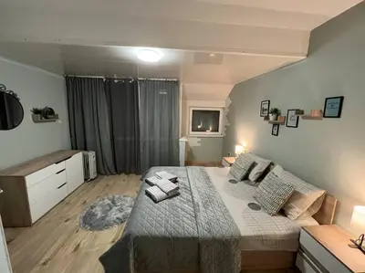 a bedroom with a large bed in a room at Център Варна апартамент с паркинг за нормална до средно голяма кола in Varna City