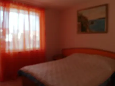 a bedroom with a bed and a window at Apartments Bravo 1-Vichevi in Sunny Beach