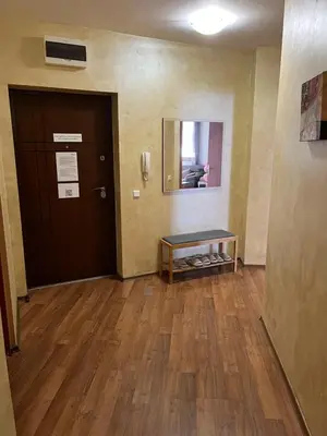 an empty room with a door and a table at EGGO APARTMENT - Oasis Beach Apartments Kamchia in Dolen Bliznak
