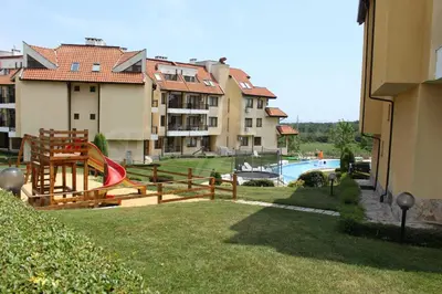 a view of a resort with a pool and some buildings at EGGO APARTMENT - Oasis Beach Apartments Kamchia in Dolen Bliznak
