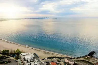 an aerial view of a beach and the ocean at Stylish Sea View Apartment 3 Min to Beach Balcony & Comfort in Pomorie