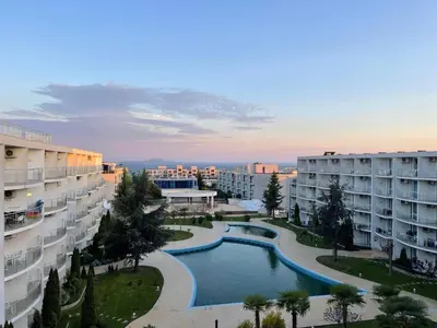 an apartment complex with a swimming pool and buildings at Blue Horizon Sarafovo in Burgas City