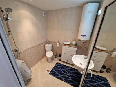 a bathroom with a sink and a toilet and a shower at Aqua Dreams A4, Sveti Vlas , A much sought after complex. in Burgas City