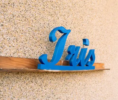 a blue sign that says july on a wooden stick at Indigo Villas in Pismenovo