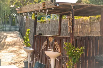 a bird feeder on the side of a wooden fence at Indigo Villas in Pismenovo