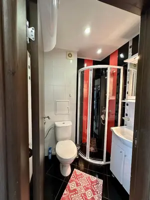 a bathroom with a toilet and a shower and a sink at Sea View Private Studio Paradiso B 508 in Nesebar