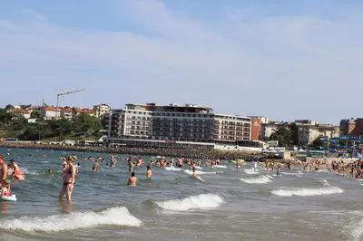 a group of people in the water at a beach at Sea View Private Studio Paradiso B 508 in Nesebar