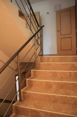a set of stairs with a door in a building at Вила Дафни - Villa Dafni in Sozopol