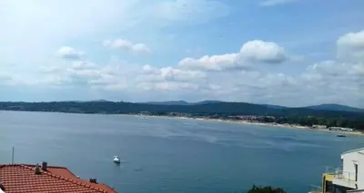 a large body of water with a boat in it at Вила Дафни - Villa Dafni in Sozopol