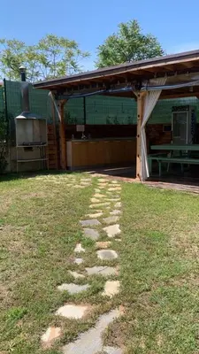 a stone path in the grass in front of a building at Sozopoli Hills Apartment А4 in Sozopol