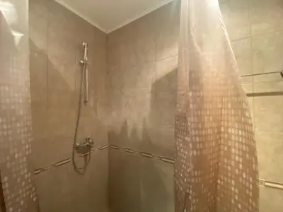 a shower with a shower curtain in a bathroom at PANORAMA BAY 20 Fancy Studio in Sveti Vlas