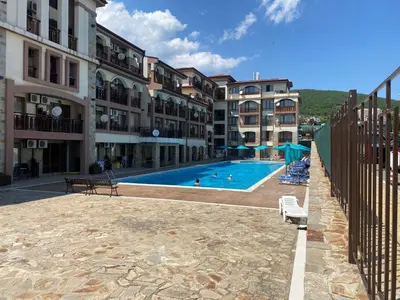 a swimming pool in front of some apartment buildings at PANORAMA BAY 20 Fancy Studio in Sveti Vlas