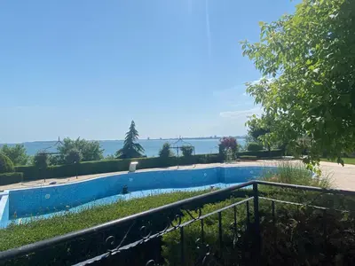 a swimming pool with a view of the water at ROYAL BAY 6 Sea View Apartment in Sveti Vlas