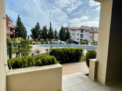 a view of a pool from a balcony of a apartment at Sveti Vlas - Central Beach Studio by Flat Mаnаger in Sveti Vlas