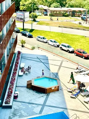 an overhead view of a swimming pool in a parking lot at One Bedroom Private Apartment Paradiso B 501 in Nesebar