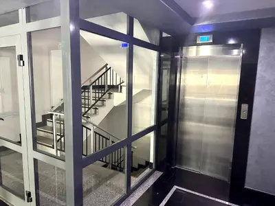 a view of a staircase through a glass door at One Bedroom Private Apartment Paradiso B 501 in Nesebar