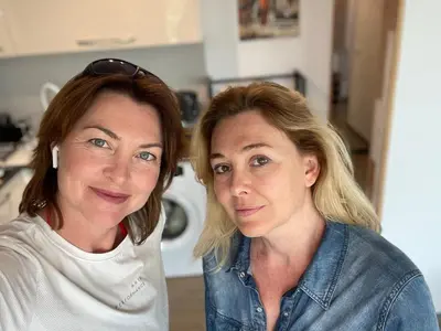 two women are standing next to each other at Panoramic apartment in Varna with underground parking in Varna City