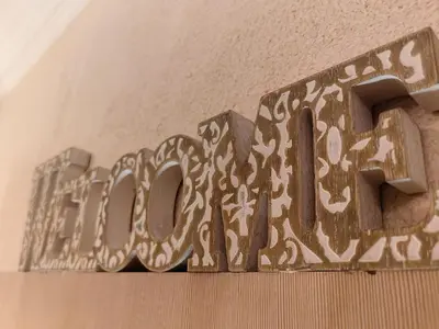 a metal sign that says doom on a wall at Нощувки Свети Влас Комплекс Амфора , студио 704 in Sveti Vlas