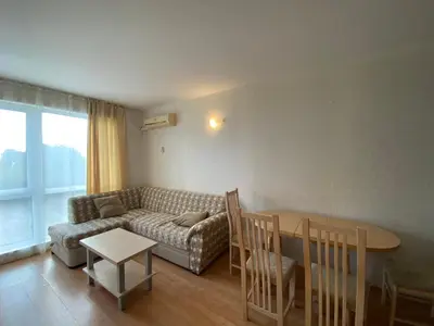a living room with a couch and a table at RUTLAND BEACH C8 Two Bedroom Apartment Ravda in Ravda