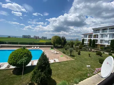 a resort with a swimming pool and a building at RUTLAND BEACH C8 Two Bedroom Apartment Ravda in Ravda