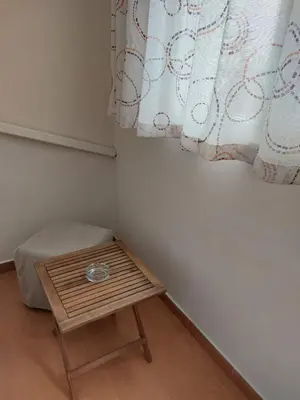 a small room with a table and a curtain at Deni's Apartment by the sea – Burgas in Burgas City